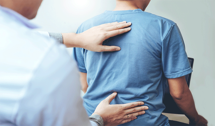 chiro exam man bigstockphoto